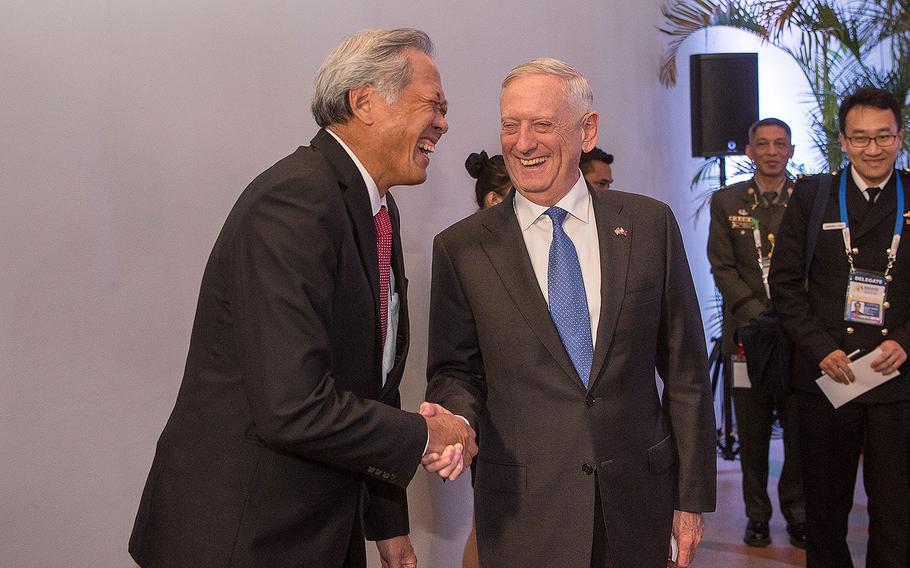 Defense Secretary Jim Mattis shakes hands with Singapore's Minister of Defense Ng Eng Hen following a meeting with the Association of Southeast Asian Nations Defense Ministers (ASEAN) in Clark, Philippines on Oct. 24, 2017.