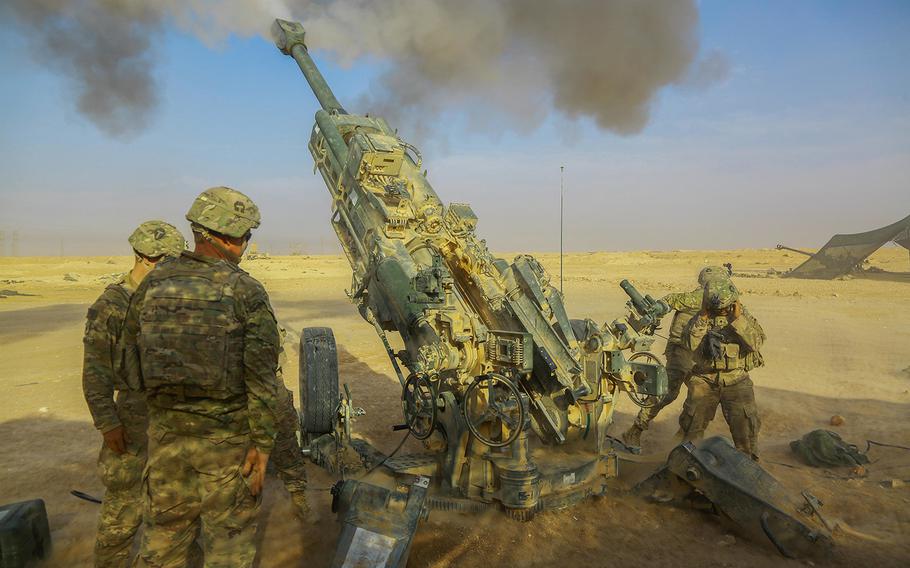 U.S. Army soldiers assigned to 5-25 Field Artillery, Battery C, 2nd Platoon fires a Howitzer M-777 A2 in support of Iraqi Security Forces near Al Qaim, Iraq, Nov. 07, 2017.