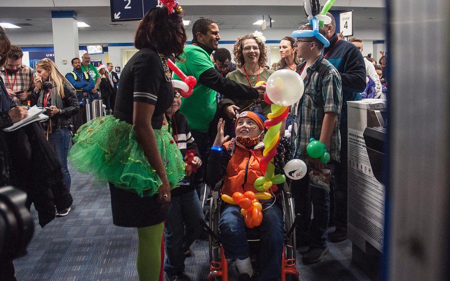 O'Rian Jolley, 12, prepares to board United Airlines' Fantasy Flight to the "North Pole" at Washington-Dulles International Airport in Virginia on Saturday, Dec. 9, 2017.