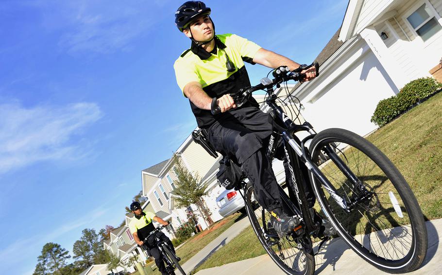 U.S. Air Force Airman 1st Class Cartier Johnson, left, and Airman 1st Class Charles Gaines, 20th Security Forces Squadron bike patrolmen, patrol base housing at Shaw Air Force Base, South Carolina, Nov. 15, 2017. Every bike patrol shift consists of two patrolmen who watch over base housing every day from 6 a.m. until 8 p.m.