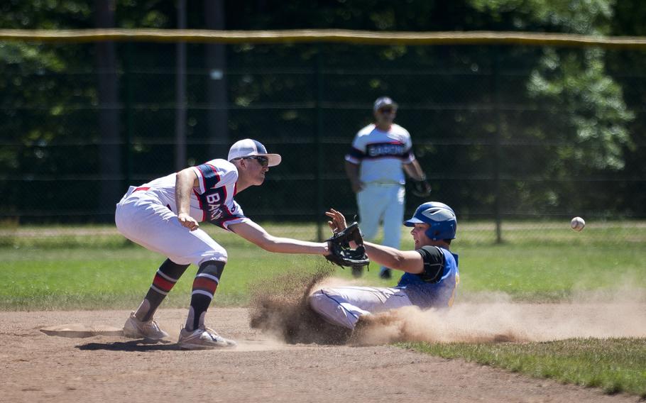 Sigonella's Alex Ogletree, right, slides to second ahead of a throw to Bitburg's Max Little during the DODEA-Europe Division II/III baseball championship at Ramstein Air Base, Germany, on Saturday, May 27, 2017. Sigonella won the game 10-1.
                