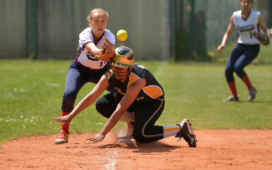 Vicenza's Beatrice Afoa-Galo reaches third base as Lakenheath's Reiley Kenk waits for the throw in a Division I game at the DODEA-Europe softball tournament in Ramstein, Germany, Thursday, May 25, 2017. Lakenheath won 15-5.
                