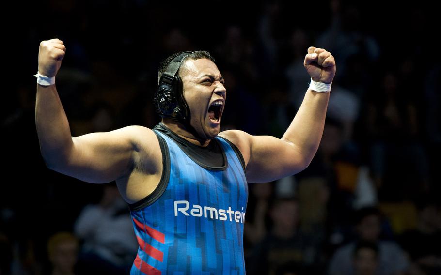 Ramstein's Erik Gerena celebrates winning the 220-pound weight class during the DODEA-Europe wrestling championship in Wiesbaden, Germany, on Saturday, Feb. 18, 2017.
                