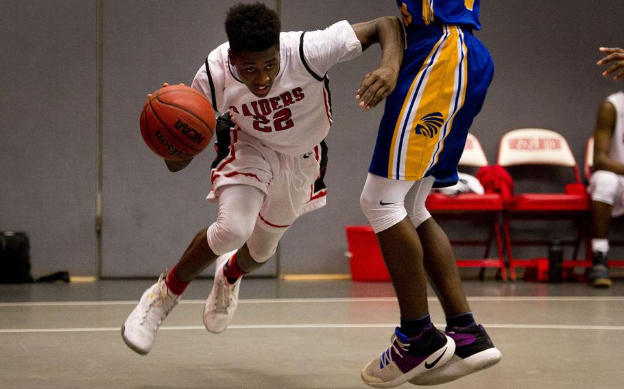 Kaisersalutern's Marlon Robbins, left, dribbles past Wiesbaden's Josh Osakwe at Vogelweh, Germany, on Tuesday, Jan. 31, 2017. Kaiserslautern lost 57-56.
                