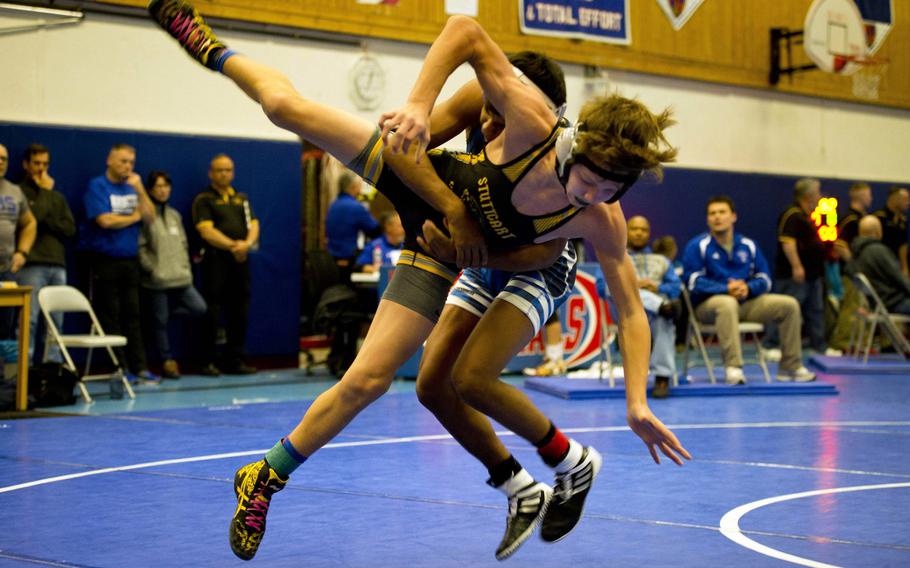 Ramstein's Tyler Kostos, rear, takes Stuttgart's Matthew Bolduc to the mat during a match at Ramstein Air Base, Germany, on Saturday, Jan. 14, 2017.
                
