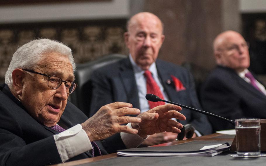Former Secretary of State Henry Kissinger addresses members of the Senate Armed Services Committee on Capitol Hill in Washington, D.C., on Thursday, Jan. 25, 2018, as former Secretary of State George Shultz, cente,r and former Deputy Secretary of State Richard Armitage listen. Kissinger warned that a collapse of world order has been gaining momentum for two decades.
