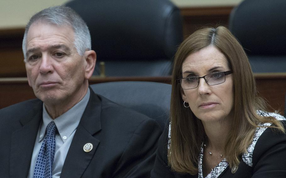 Rep. Ralph Abraham, R-La., and Rep. Martha McSally, R-Ariz., listen to testimony during a House Armed Services subcommittee hearing on senior military leader misconduct, Feb. 7, 2018 on Capitol Hill.