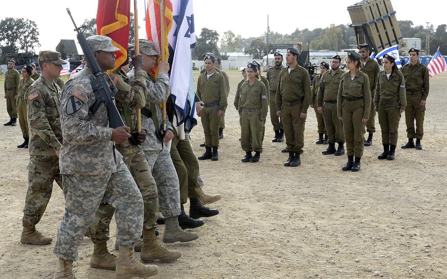 In a March, 2016 file photo, U.S. military and Israeli Defense Forces personnel mark the conclusion of the most recent Juniper Cobra exercise at Hazor Air Force Base, Israel.