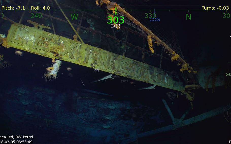 The USS Lexington's name remains visible on several areas, and an intact fighter plane is still emblazoned with U.S. star emblems.
