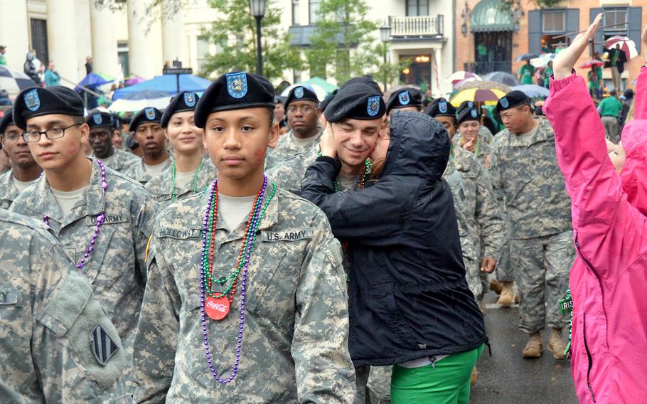 A 3rd Combat Aviation Brigade soldier looks on while marching in the St. Patrick's Day Parade in downtown Savannah on March 17, 2014.