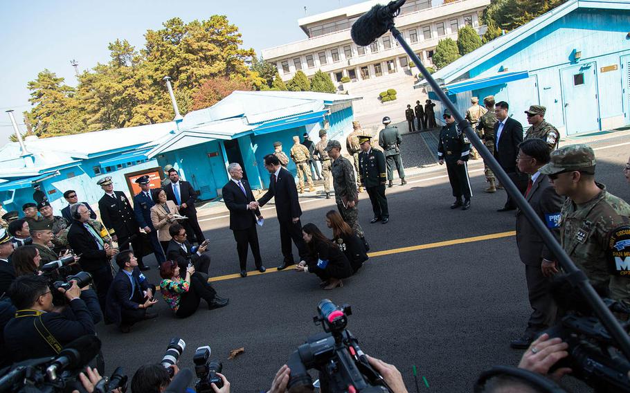 Secretary of Defense Jim Mattis greets South Korean Defense Minister Song Young-moo near the Military Demarcation Line at Panmunjom, South Korea, Friday, Oct. 27, 2017.