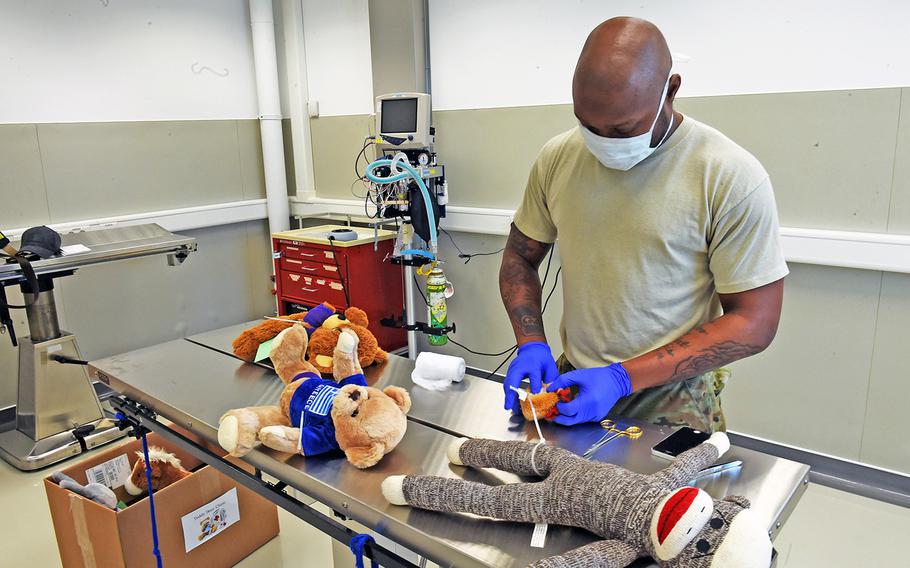 Veterinarian technician Spc. Michael Simmons operates on a stuffed animal at the base animal hospital in Vilseck, Germany, Monday, May 7, 2018.