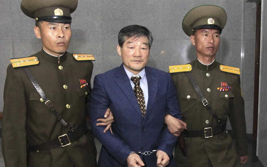 Kim Dong Chul, center, a U.S. citizen detained in North Korea, is escorted to his trial in Pyongyang, North Korea, on April 29, 2016.