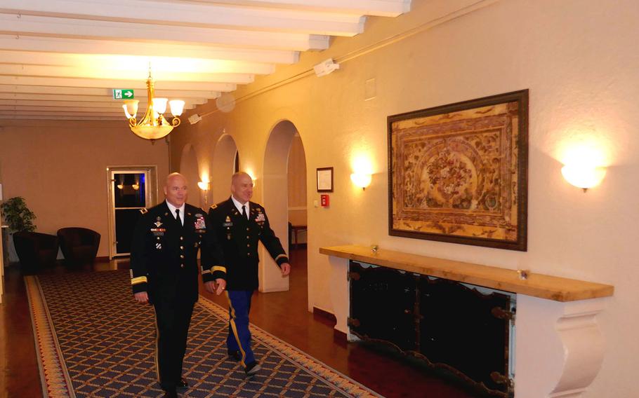 Maj. Gen. Roger Cloutier, U.S. Africa Command's chief of staff, left, walks with Col. Richard Gulley during Gulley's June 30, 2017, retirement ceremony in Stuttgart, Germany. Gulley, along with numerous other reservists, says he was unfairly targeted by Army investigators over housing benefits.