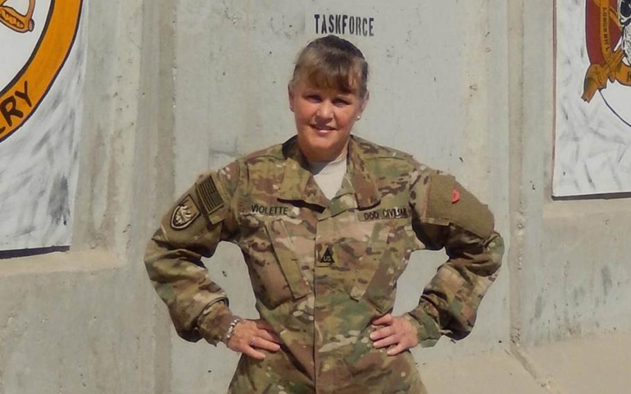 Chanteen Violette, shown here during her deployment to Afghanistan, was considered eligible for living quarters allowance under Army regulations when she accepted her job. But new Army guidance determined that she isn’t eligible for LQA.