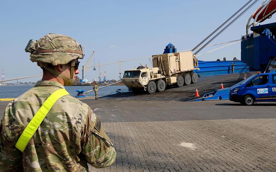 A soldier from the 1st Armored Brigade Combat Team, 1st Cavalry Division, waits for an opening on the receiving line for vehicles leaving the cargo ship Endurance in Antwerp, Belgium, Sunday, May 20, 2018. The soldier pictured is part of a 3,500-person force deployed to Europe for nine months in support of Atlantic Resolve.
Will Morris/Stars and Stripes