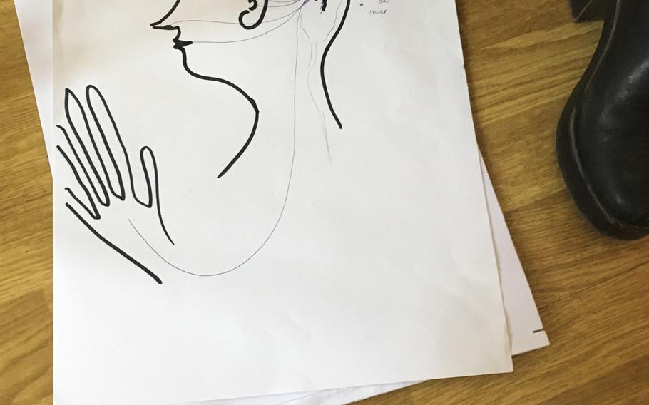 Red Cross psychologist Susanne Sage often draws to explain mental health concepts to her patients, who are migrants that usually speak a different language. Sage opened a mental health clinic for migrants with traumatic experiences last fall in Kaiserslautern, Germany.