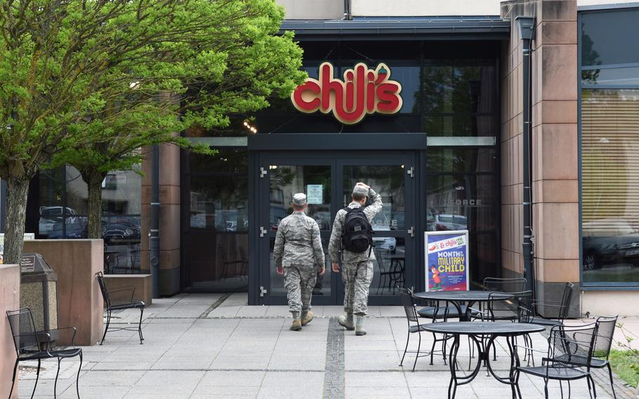 Airmen walk into Chili's at Ramstein Air Base, Germany, on April 25, 2018. Chili's is among the establishments on base that employs third-country nationals. Their employment status recently changed; now they fall under the host nation, non-U.S. employment program.