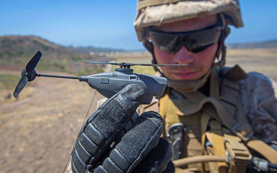 Lance Cpl. Cesar Salinas, an infantry Marine with 3rd Battalion, 5th Marine Regiment, displays the PD-100 Black Hornet after an exercise on Camp Pendleton, Calif., July 9, 2016.