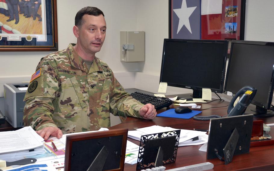 Col. Timothy Hudson, commander of Landstuhl Regional Medical Center, sits at his desk Friday after being reinstated following the completion of a three-month investigation, which found no mismanagement or inappropriate behavior.