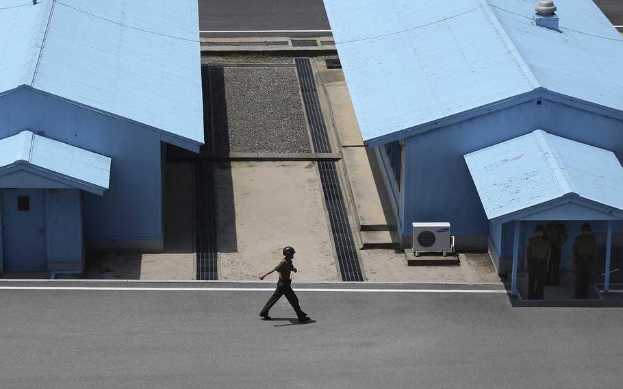 A North Korean soldier marches at the truce village at the Demilitarized Zone, which separates the two Koreas in Panmunjom, North Korea, Wednesday, June 20, 2018.