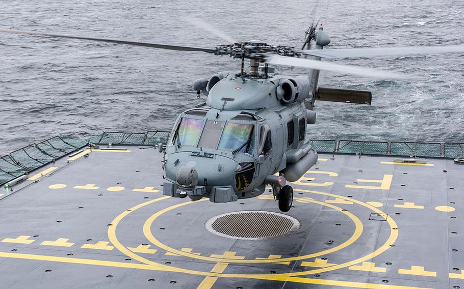 A helicopter takes off from a Norwegian naval ship on June 29, 2018, on the north Atlantic near Norway for Dynamic Mongoose. The two-week NATO maritime exercise is aimed at improving allied nations' anti-submarine warfare.
