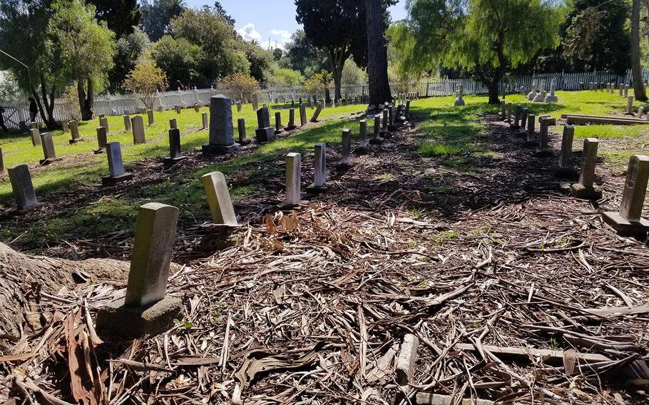 The Mare Island Naval Cemetery, the oldest military graveyard on the West Coast, is in dilapidated conditions. The landscape of the Vallejo, Calif., graveyard is marked by patches of grass, weeds and piles of bark. Some 19th century headstones are falling and held up by logs. Stone work throughout the site is crumbling. A white picket fence that has darkened over time is falling.