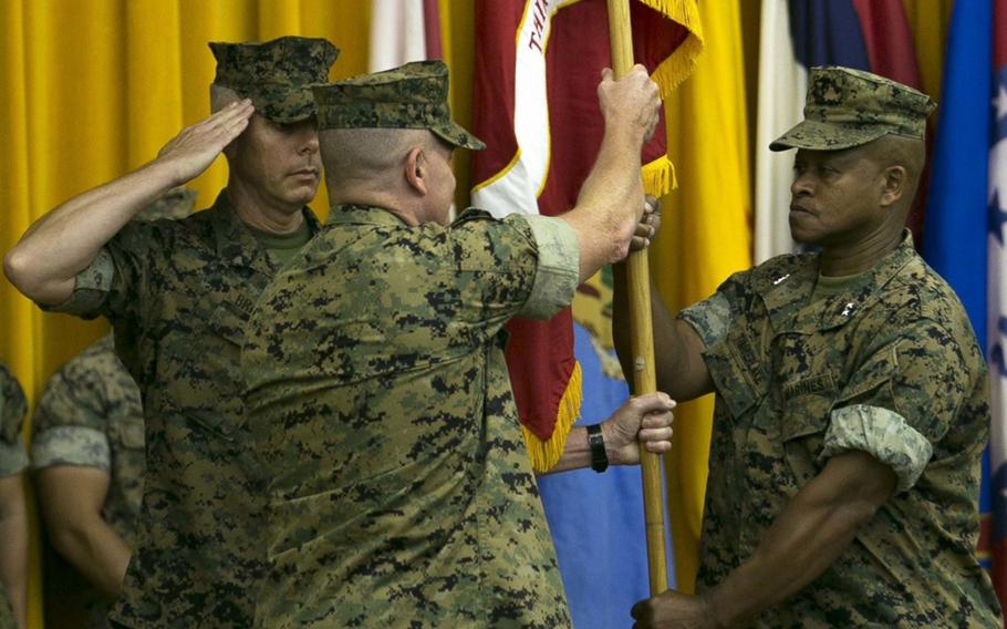 Brig. Gen. Craig Q. Timberlake, the commanding general of 3rd Marine Division, relinquishes command to Brig. Gen. William M. Jurney during a change-of-command ceremony on Camp Courtney, Okinawa, July 6, 2018.