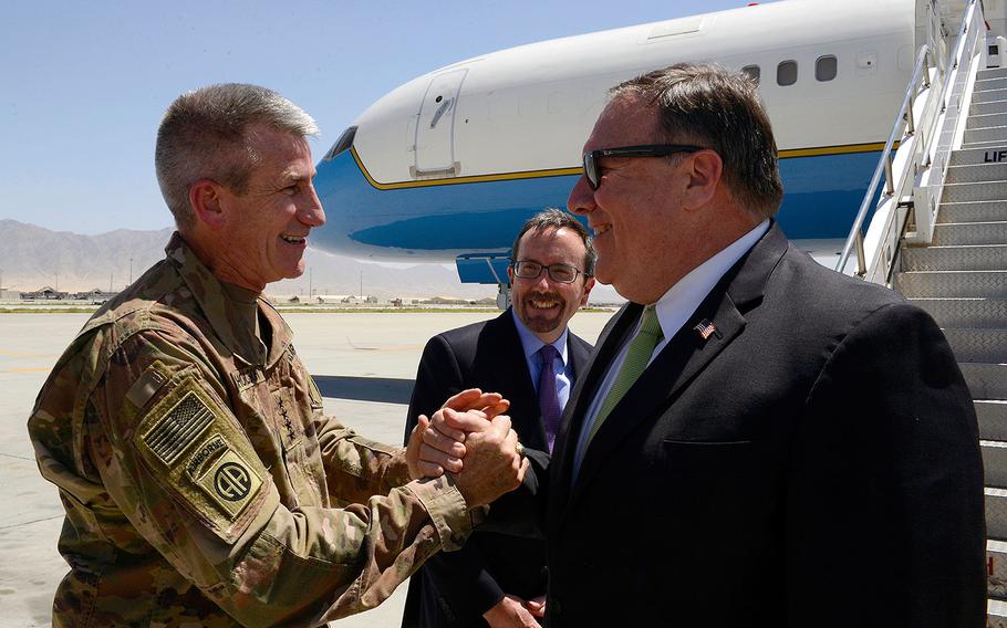 U.S. Army Gen. John Nicholson, Resolute Support commander, and John Bass, U.S. Ambassador to Afghanistan, greet U.S. Secretary of State Mike Pompeo during his arrival at Bagram Airfield, Afghanistan, July 9, 2018.