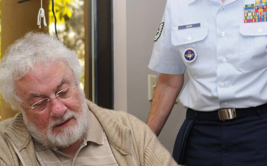 In a 2008 file photo, Adrian Cronauer signs a poster for Tech. Sgt. Barney Burr, 335th Training Squadron, at Keesler Air Force Base.