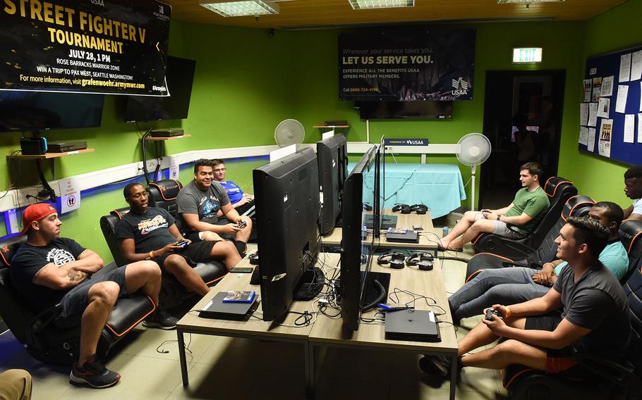 Soldiers compete and watch the Street Fighter V tournament at Grafenwoehr, Germany, Saturday, July 28, 2018.