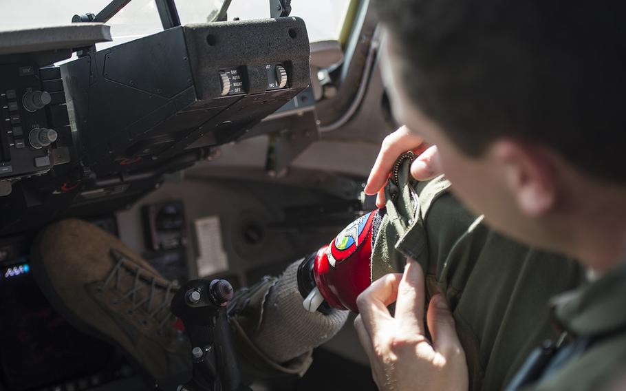 U.S. Air Force Capt.Ryan McGuire, C-17 Globemaster III pilot with the 535th Airlift Squadron, adjusts his prosthetic before a training flight, Sep 12, 2017 on Joint Base Pearl Harbor-Hickam. Servicemembers wounded in combat who are unable to deploy will not face mandatory separation under a new Defense Department Defense policy.