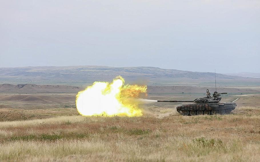 A Georgian Armed Forces T-72 tank engages targets down range as part of a live fire training during Noble Partner 18 at the Vaziani Training Area, Georgia, Aug. 4, 2018.