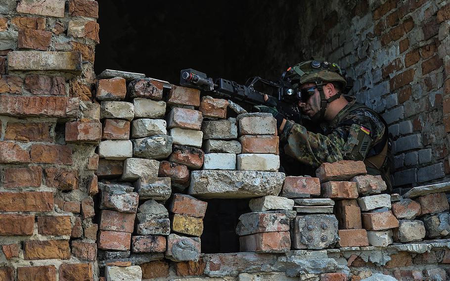 A German army infantryman with the 391st Mechanized Infantry Battalion pulls security in a recently-secured building at Vaziani Training Area, Georgia, Aug. 5, 2018. 