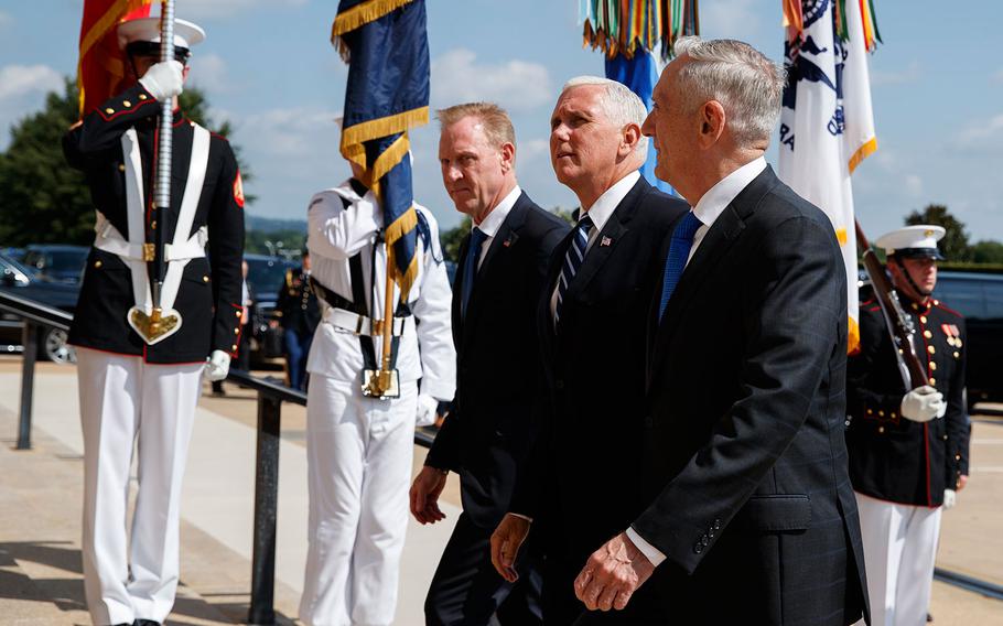 Vice President Mike Pence, center, is greeted by Deputy Secretary of Defense Pat Shanahan, left, and Secretary of Defense Jim Mattis before speaking at an event on the creation of a United States Space Force, Thursday, Aug. 9, 2018 at the Pentagon.