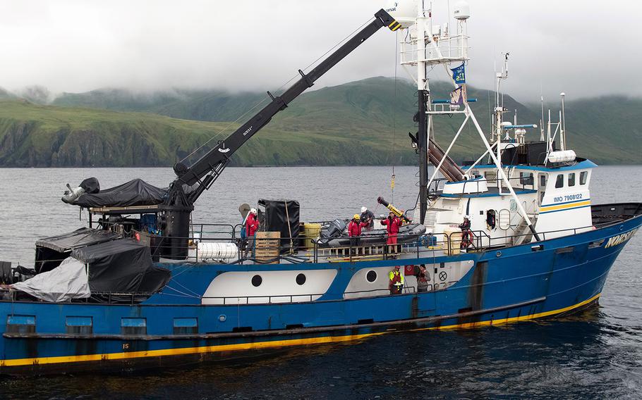 Members of Project Recover launch one of four underwater vehicles used to search the seafloor near the Aleutian Islands for wreckage from World War II. Researchers were aboard Norseman II, a research vessel, in July.