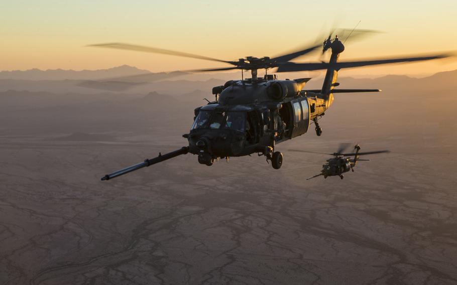 A pair of U.S. Army MH-60M Blackhawks prepare to conduct an aerial refueling exercise over Yuma, Ariz., Oct. 6, 2017. A coalition servicemember was killed and several were wounded after a helicopter crashed in Iraq late Sunday, military officials said. According to Newsweek, it was a MH-60 Black Hawk.
                