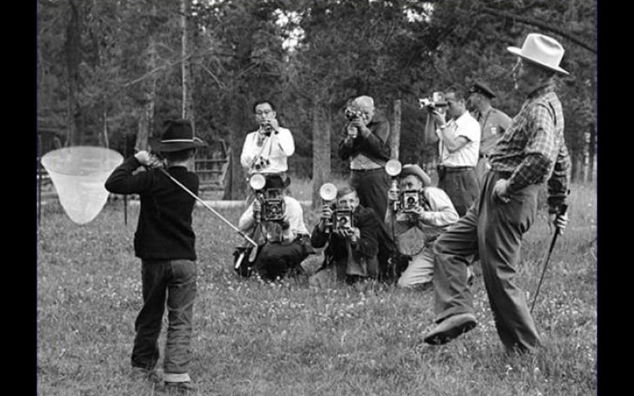 Former President Dwight D. Eisenhower gives his grandson a golf lesson at Fraser, Colo., in August 1955. Eisenhower was an enthusiastic golfer and his vacation home was an easy stroll from the greens at the Augusta National Golf Club in Georgia. 