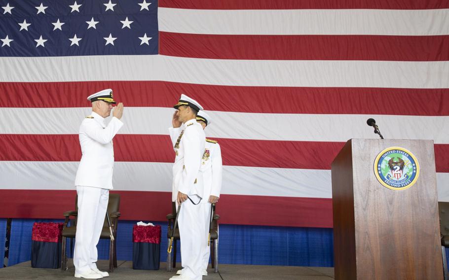 Adm. Chris Grady, commander, U.S. Fleet Forces Command, left, returns Vice Adm. Andrew “Woody” Lewis' salute as Lewis assumes command of U.S. 2nd Fleet aboard the nuclear aircraft carrier USS George H.W. Bush. U.S. 2nd Fleet will exercise operational and administrative authorities over assigned ships, aircraft and landing forces on the East Coast and North Atlantic.