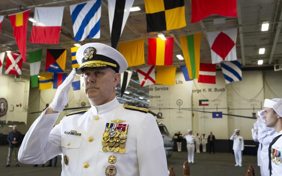 Adm. Chris Grady, commander, U.S. Fleet Forces Command, salutes the sideboys as he arrives to the U.S. 2nd Fleet establishment ceremony aboard the nuclear aircraft carrier USS George H.W. Bush. U.S. 2nd Fleet will exercise operational and administrative authorities over assigned ships, aircraft and landing forces on the East Coast and North Atlantic. 