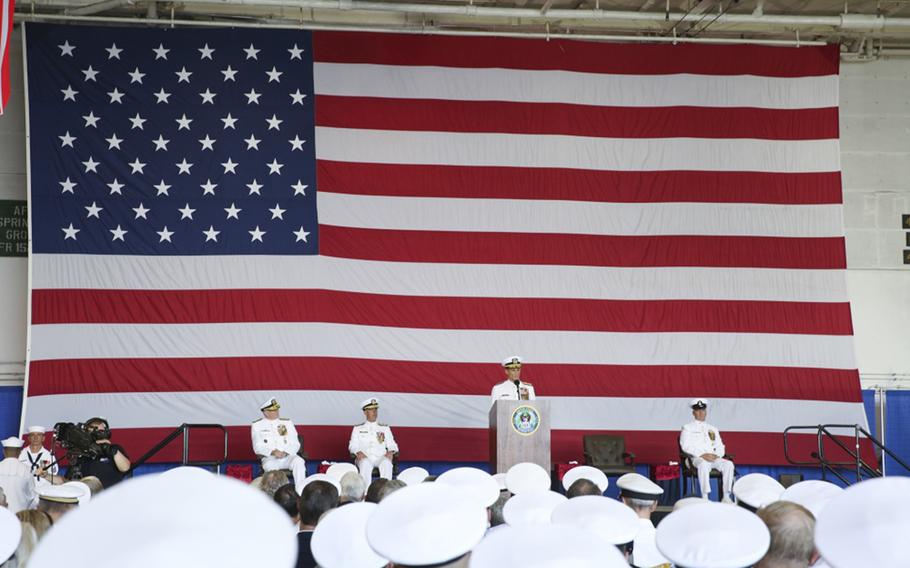 Vice Adm. Andrew “Woody” Lewis, center, address guests aboard the nuclear aircraft carrier USS George H.W. Bush as he assumes command of U.S. 2nd Fleet. U.S. 2nd Fleet will exercise operational and administrative authorities over assigned ships, aircraft and landing forces on the East Coast and North Atlantic. 