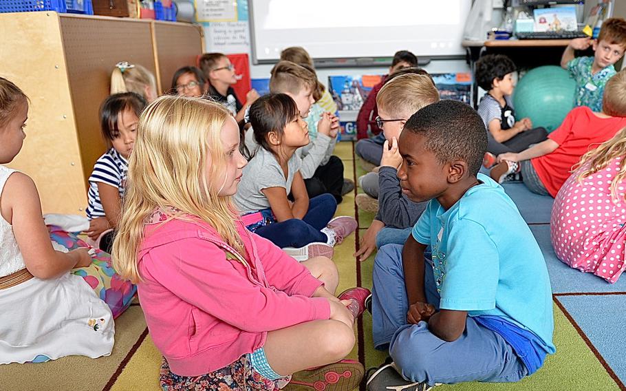 Conversation partners Victoria Hutchison and Jude Holmes talk about "First Day Jitters," a book by Julia Danneberg about being nervous the first day of school, Landstuhl Elementary/Middle School, Germany, Monday, Aug. 27, 2018. 
                