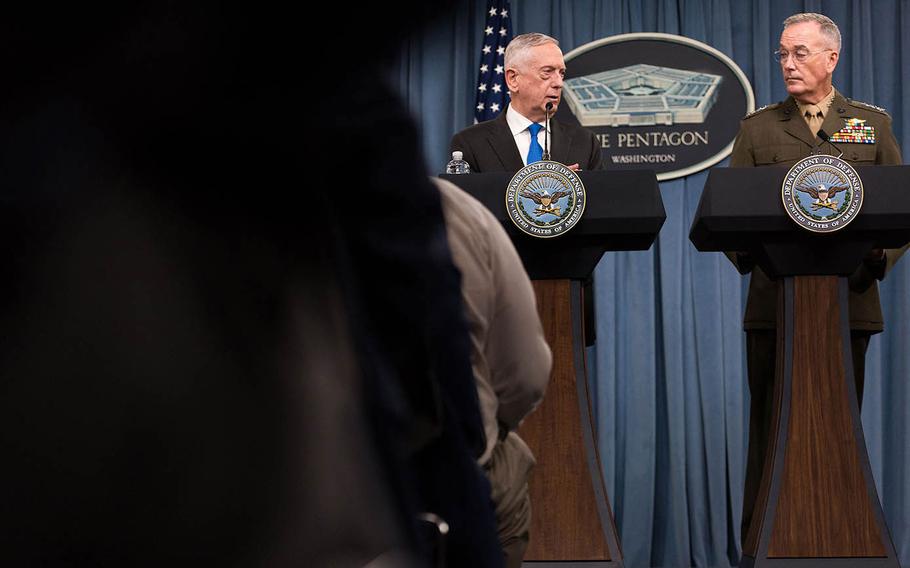 Defense Secretary Jim Mattis and Marine Gen. Joseph Dunford, the chairman of the Joint Chiefs of Staff, speak during a press conference Tuesday, Aug. 28, 2018 at the Pentagon.