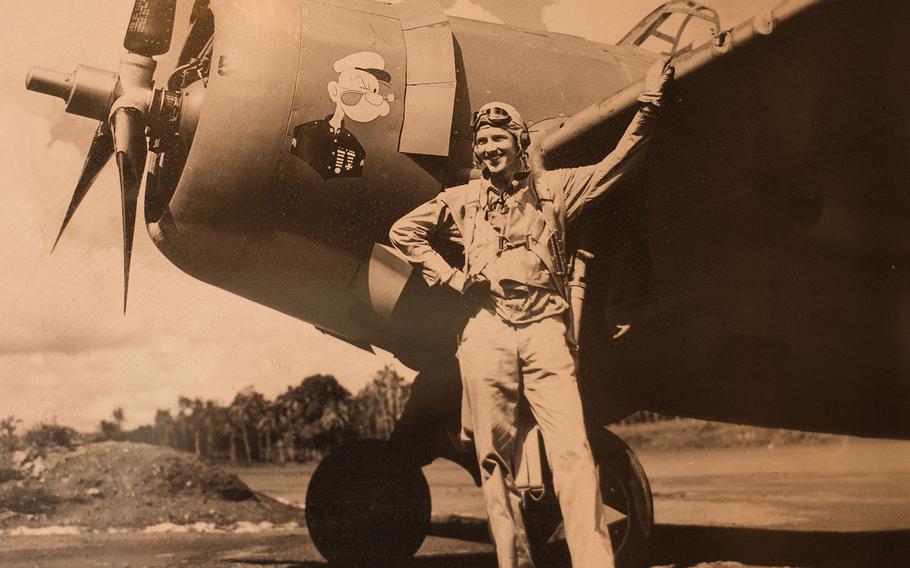 Sam Folsom poses in Samoa with his F4F Wildcat with Popeye art in 1942, after he left the Battle of Guadalcanal in World War II. He was credited with shooting down three Japanese aircraft -- two G4M Betty Bombers and a D3A Val dive bomber-- at Guadalcanal. 