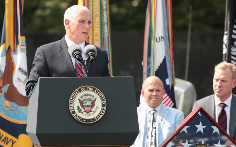 Vice President Mike Pence speaks in front of the Korean War Memorial in Washington, D.C., on Thursday, Sept. 20, 2018. Behind Pence sits a flag that was used in the transfer of remains ceremony that saw the remains of 55 American fighters killed in the Korean War returned to the U.S.