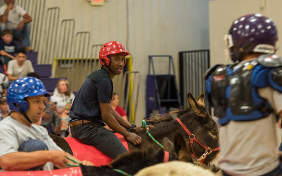Khalil Davis, space vehicle operator with the 1st Space Operations Squadron, keeps his eye on his opponents during the Ellicott High School donkey basketball mini-tournament on Sept. 20, 2018.