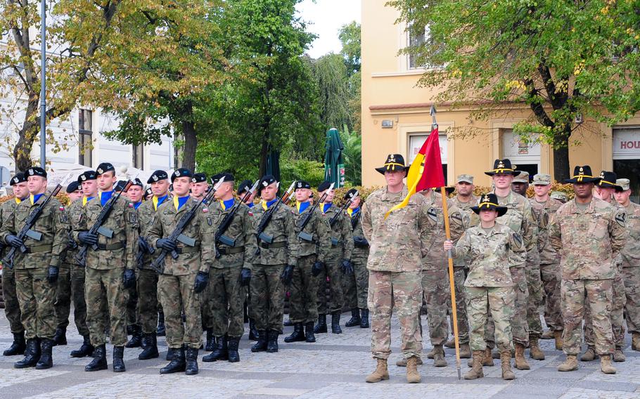 Soldiers assigned to Headquarters and Headquarters Company, 1st Armored Brigade Combat Team, 1st Cavalry Division, stand in formation alongside the Polish 11th "Lubuska" Armored Cavalry Division soldiers during a ceremony to observe the Black Division Day in Zielona Gora, Poland, Sept. 21, 2018.