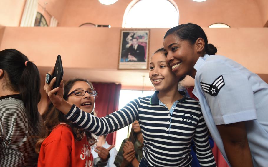 Senior Airman Sierra Bailey, a vocalist with the U.S. Air Forces in Europe Band, takes a selfie with a student at The American School in Marrakech, Morocco, on Oct. 23, 2018. Bailey and other band members traveled to Morocco last month for a number of various concerts and engagements in support of U.S. military interests.