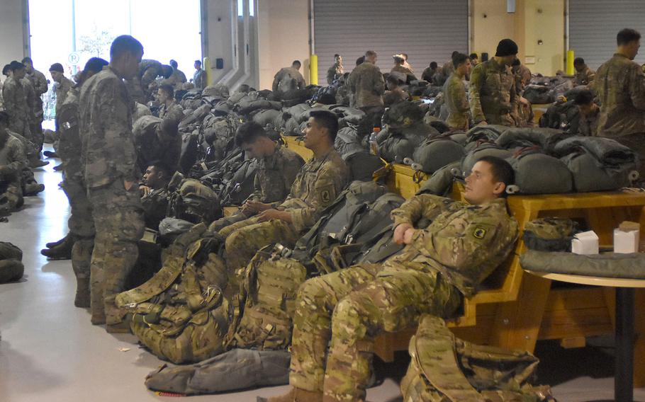 The personnel alert holding area at Aviano Air Base, Italy, is a busy place when the 173rd Airborne Brigade comes to gear up for a jump.