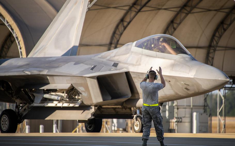 A maintenance airman guides in a 325th Fighter Wing F-22A Raptor at Eglin Air Force Base, Fla., Nov. 20. The first six Raptors arrived to their temporary home at Eglin from Tyndall Air Force Base. This move is part of mission shift by the Air Force as Hurricane Michael recovery efforts continue at Tyndall.